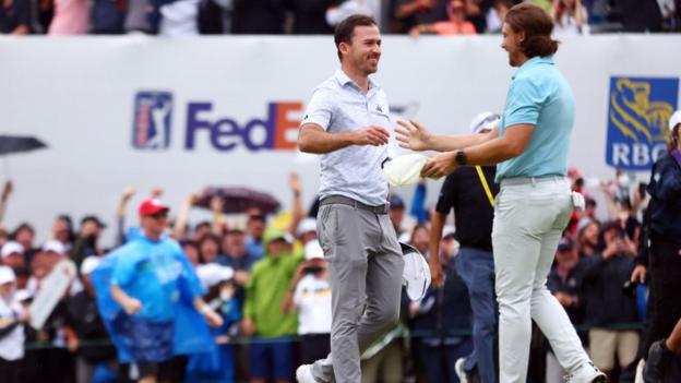 Nick Taylor and Tommy Fleetwood shake hands after a dramatic conclusion to the Canadian open