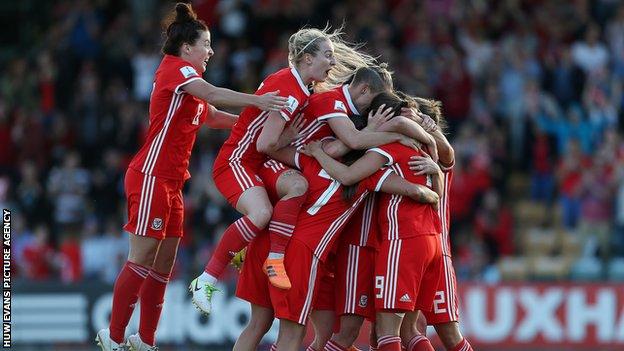 Wales women celebrate a goal