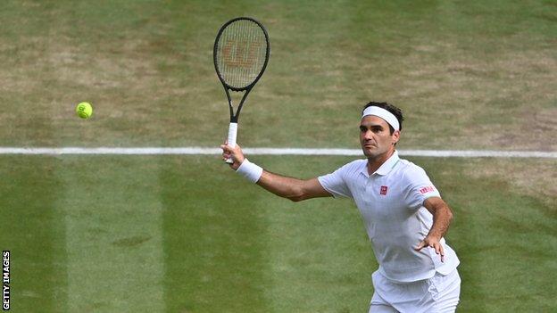 Roger Federer plays a shot during a match at Wimbledon