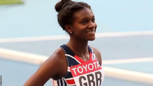 Dina Asher-Smith smiles earlier  the commencement  of a relay heat