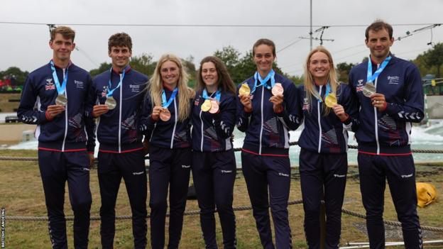Great Britain's medal winners pose with their medals on day one of the ICF Canoe Slalom World Championship