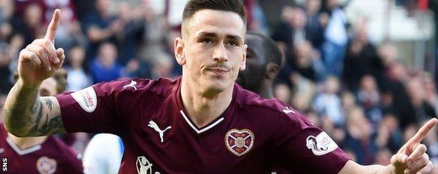 Hearts' Jamie Walker celebrates scoring from the penalty spot
