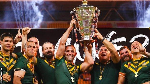 Australia players celebrate with the trophy after winning the 2017 men's Rugby League World Cup