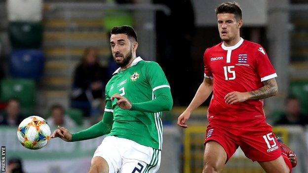 Conor McLaughlin and Seid Korac in action during the first half at Windsor Park