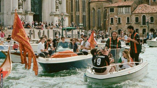 Venice fans go on boats for the parade