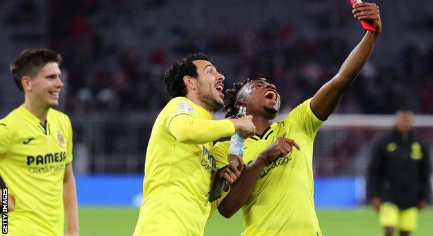 Daniel Parejo and Samuel Chukwueze celebrate Villarreal's win over Bayern Munich