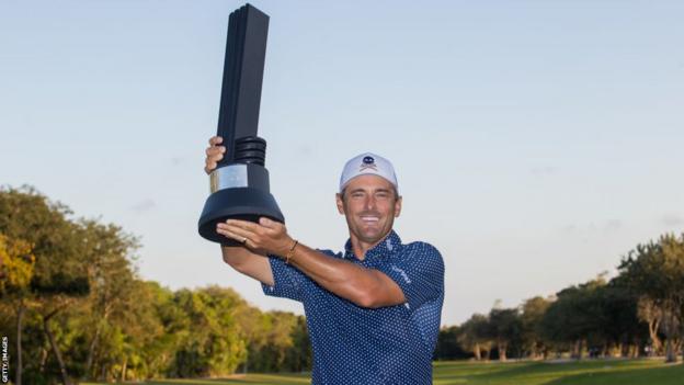 Charles Howell III celebrates with his trophy