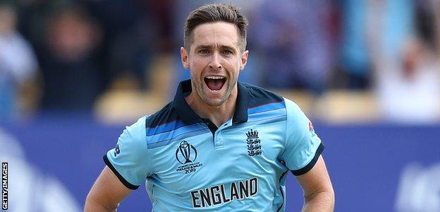 England bowler Chris Woakes celebrates dismissing David Warner in the World Cup semi-final against Australia