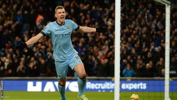 Manchester City striker Edin Dzeko celebrates scoring