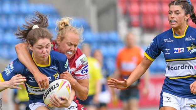 Leeds and Wigan players tussle in the Nines competition