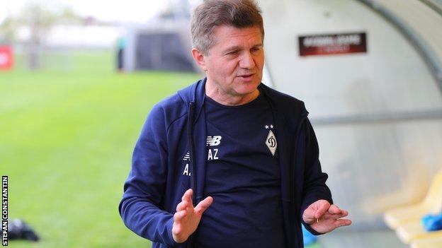 Arcadie Zaporojanu stands next to the training pitch