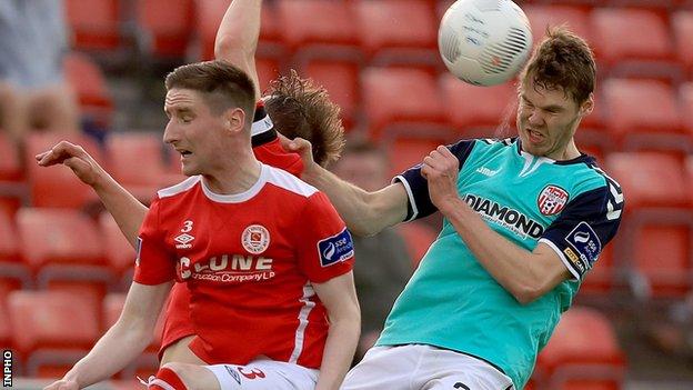 Candystripes defender Niclas Vemmelund heads clear in Friday's clash against St Pat's Athletic