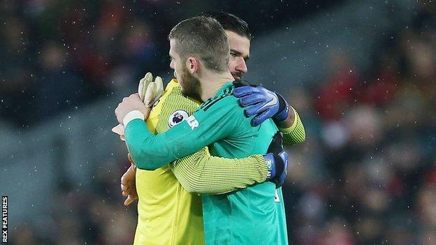 Alisson and De Gea hug