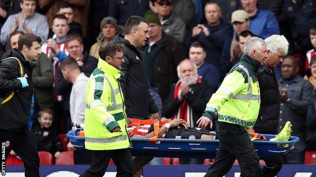 Brentford's Julian Jeanvier is stretchered off