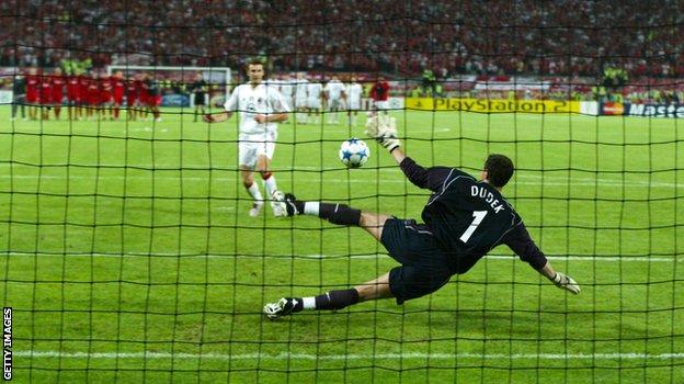 Liverpool keeper Jerzy Dudek saves Andriy Shevchenko's punishment  to clinch a 3-2 shoot-out triumph  for the Reds