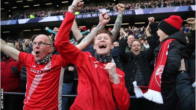 Morecambe's travelling fans were 16 minutes away from celebrating a famous FA Cup victory