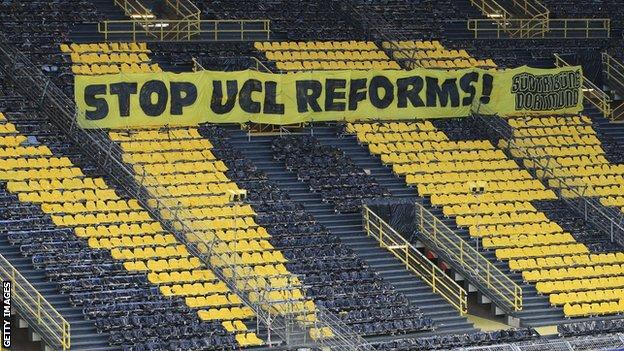 A banner against Champions League reforms was in the stands of Borussia Dortmund's stadium during their Champions League quarter-final against Manchester City