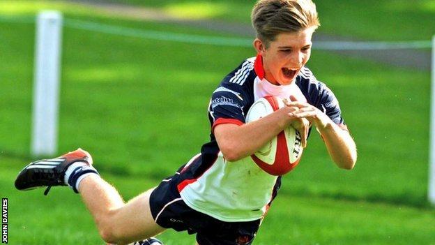 A young Harry Randall dives with the ball while playing for Llandovery College