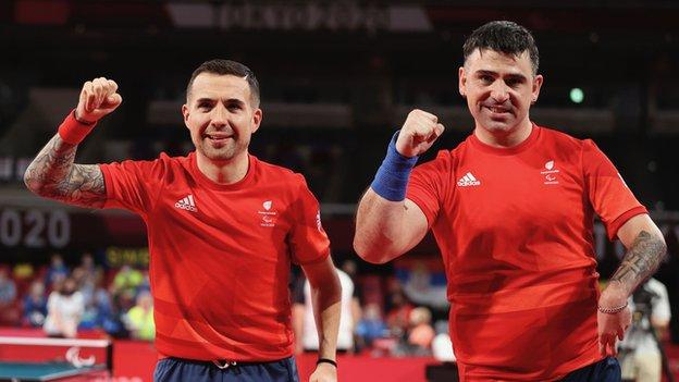 Swansea's Paul Karabardak (r) won two Paralympic table tennis medals in Tokyo, including a silver alongside Will Bayley in the men's classes 6-7 team event.