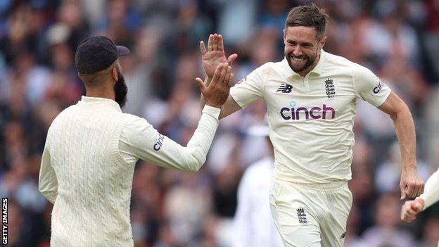 Chris Woakes celebrates with Moeen Ali