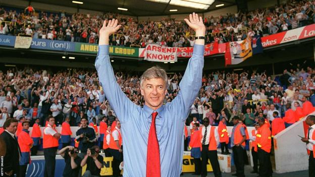 Arsenal manager Arsene Wenger celebrates winning the Premier League title