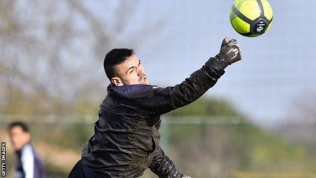 Goalkeeper Jerome Prior dives for a ball in 2018