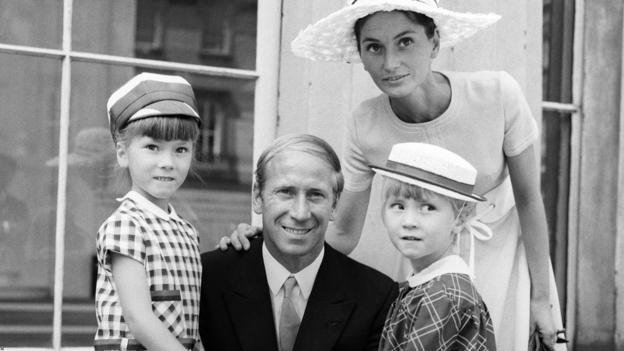 Manchester United's Bobby Charlton shows the Insignia of his OBE with his wife Norma and daughters Suzanne (6) and Andrea (4) outside Buckingham Palace in 1969