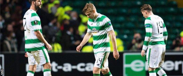 Celtic players cut dejected figures after exiting the Europa League