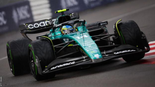 Fernando Alonso on track in rain in Monaco