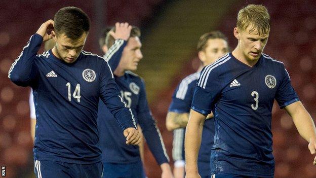 Scotland's Lawrence Shankland and Stephen Kingsley look disappointed