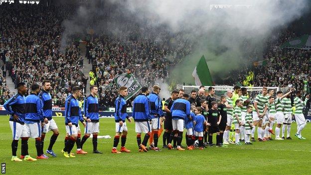 Celtic and Rangers players line up at Hampden