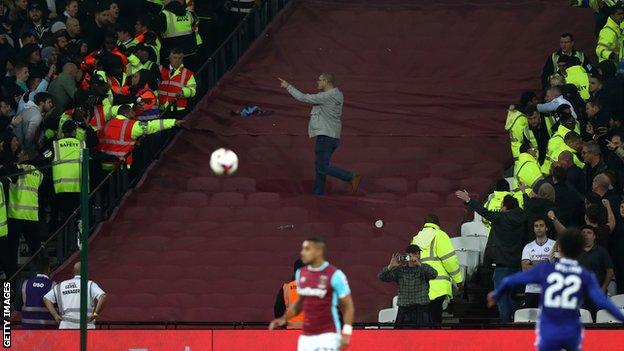 Supporters confront one another during last month's EFL Cup match between West Ham United and Chelsea at the London Stadium
