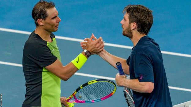 Rafael Nadal (left) and Cameron Norrie (right) shake hands at the net