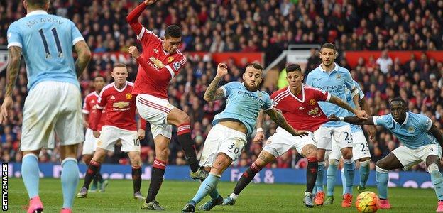 Chris Smalling has a shot for Manchester United against Manchester City in October 2015