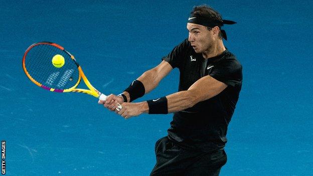 Rafael Nadal hits a backhand