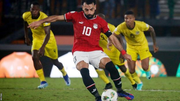 Egypt captain Mohamed Salah scores from the penalty spot against Mozambique at the 2023 Africa Cup of Nations