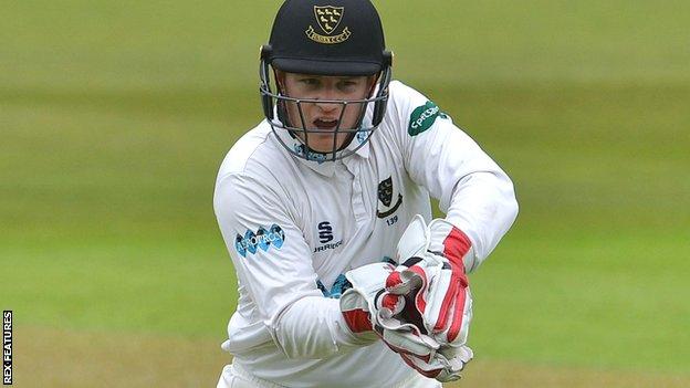 Sussex wicketkeeper Ben Brown gathers the ball