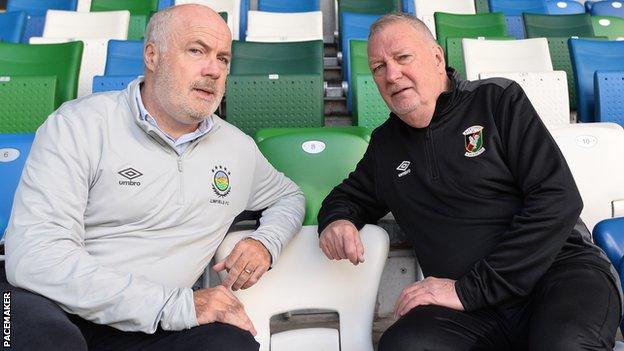 Billy Clarke, pictured here with Linfield manager Phil Lewis, took a step back at Glentoran