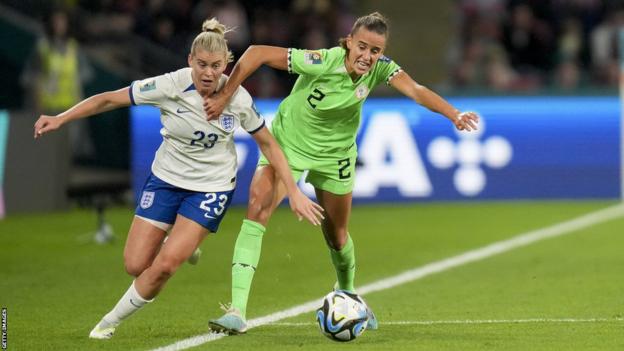Alessia Russo of England and Ashleigh Plumptre of Nigeria battle for the ball