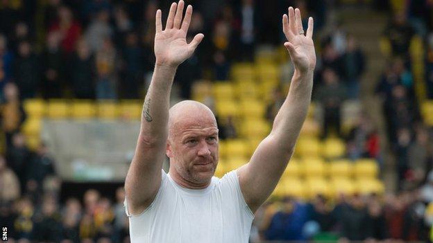 Charlie Adam waves to the Dundee fans