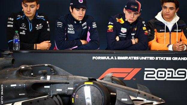 Drivers admire a 2021 F1 car mock-up