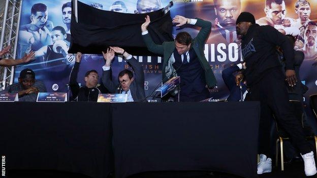 Promoter Eddie Hearn was sat in the middle of those conducting the news conference when Chisora threw the table
