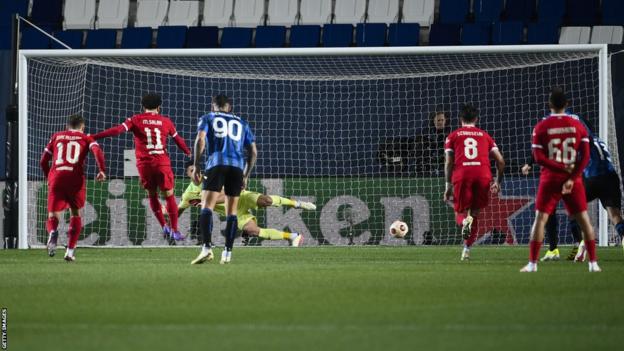 Mohamed Salah of Liverpool scores a penalty against Atalanta in the Europa League quarter-final second leg