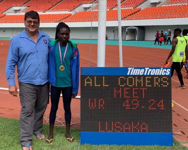 Christine Mboma and her coach Henk Botha in Zambia