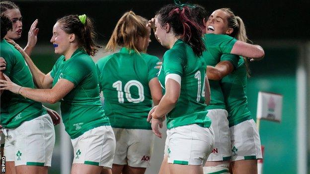 Ireland players congratulate Aoife Doyle after she scores her side's third try of the game