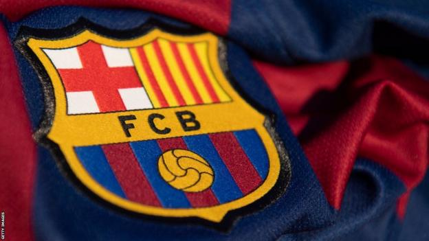 Close-up of a Barcelona badge on the team jersey