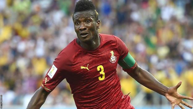 Asamoah Gyan spreads his arms to celebrate scoring for Ghana