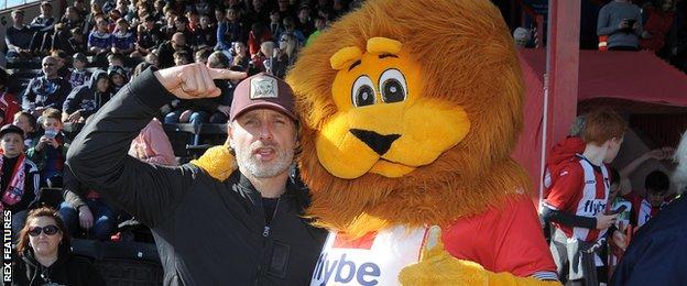 Rick Grimes takes time out from killing zombies to watch Exeter City!