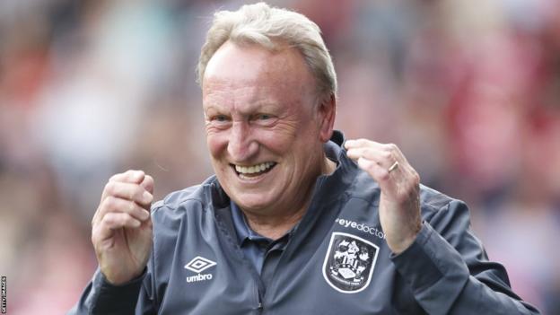 Neil Warnock celebrates while Huddersfield manager