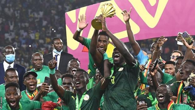 Kalidou Koulibaly lifts the Nations Cup trophy for Senegal in February 2022